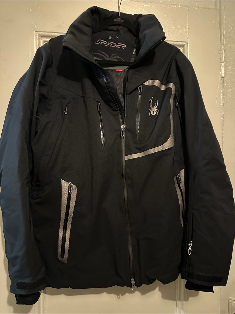 Like New Spyder Men's Black Ski Jacket with Silver Accents. Size Large.